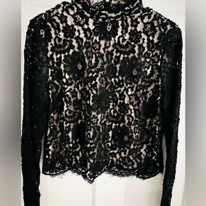 NWT-  Alice and Olivia long sleeve lined beaded lace top in black.  Size 12
